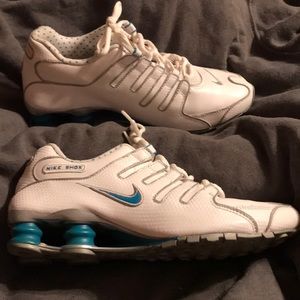 Female pair of Nike Shox. White with blue details.